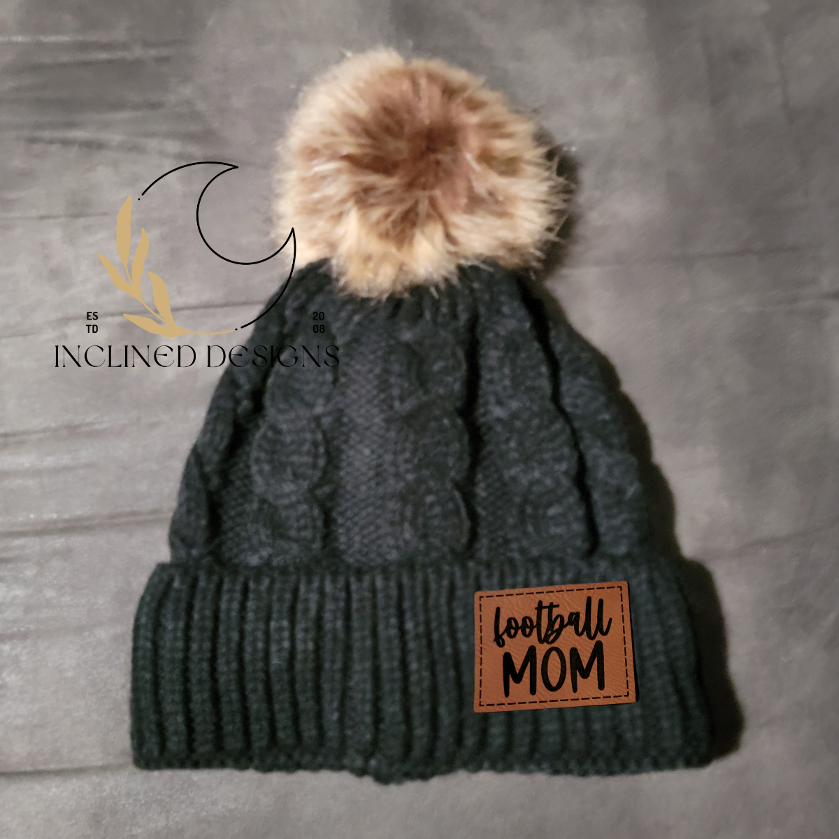 Knit Hat with Faux Fur Pom and Leatherette Patch