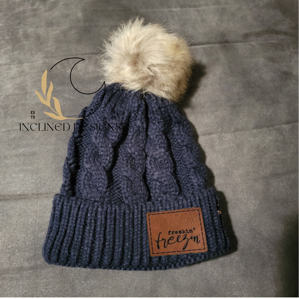 Knit Hat with Faux Fur Pom and Leatherette Patch