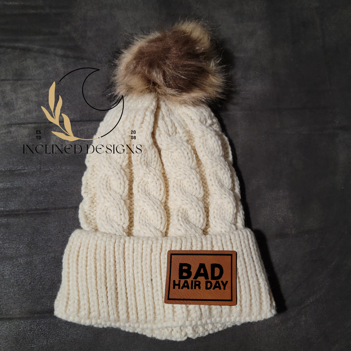 Knit Hat with Faux Fur Pom and Leatherette Patch