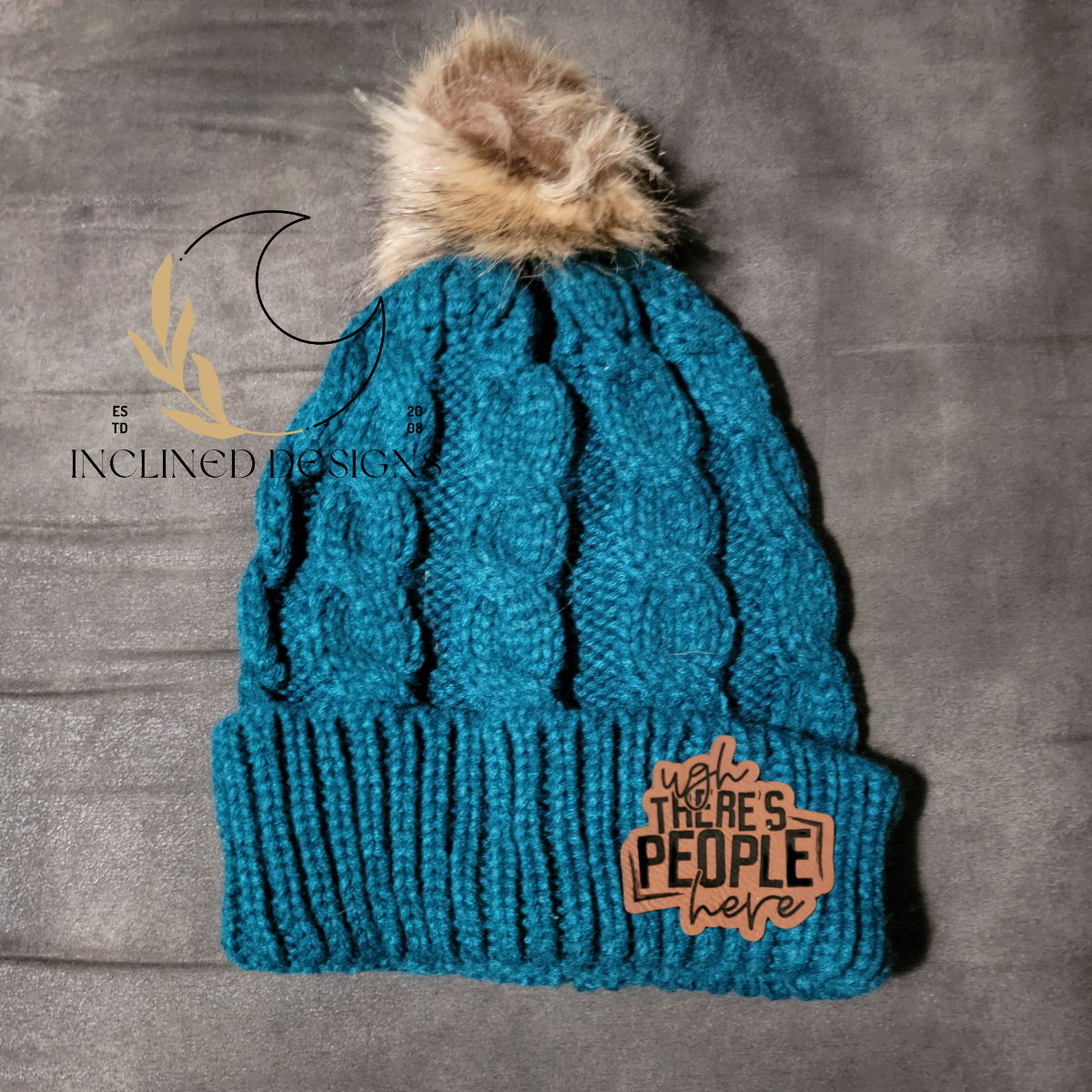 Knit Hat with Faux Fur Pom and Leatherette Patch